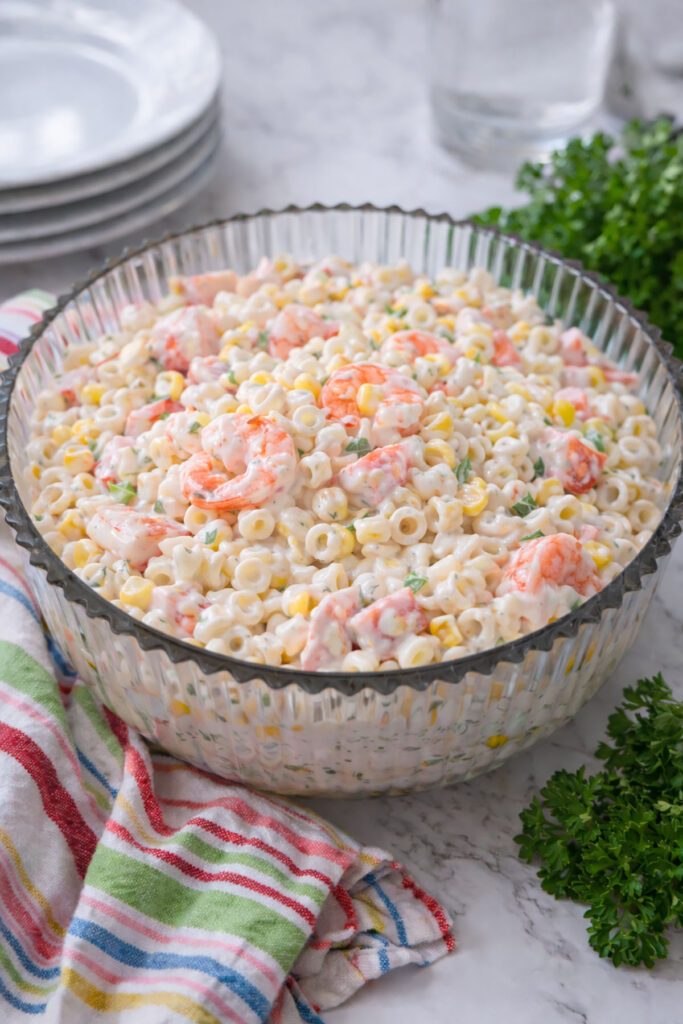 Seafood Salad in a bowl with a colorful napkin on the left.