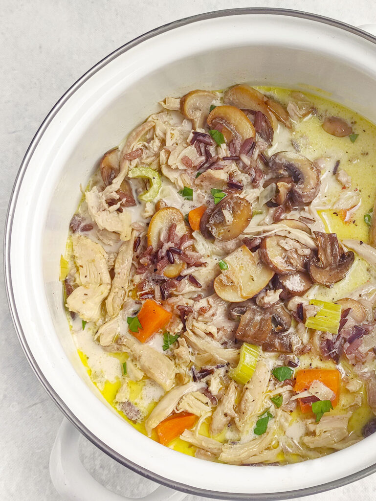 A close up of the chicken mushroom wild rice soup in the pot.