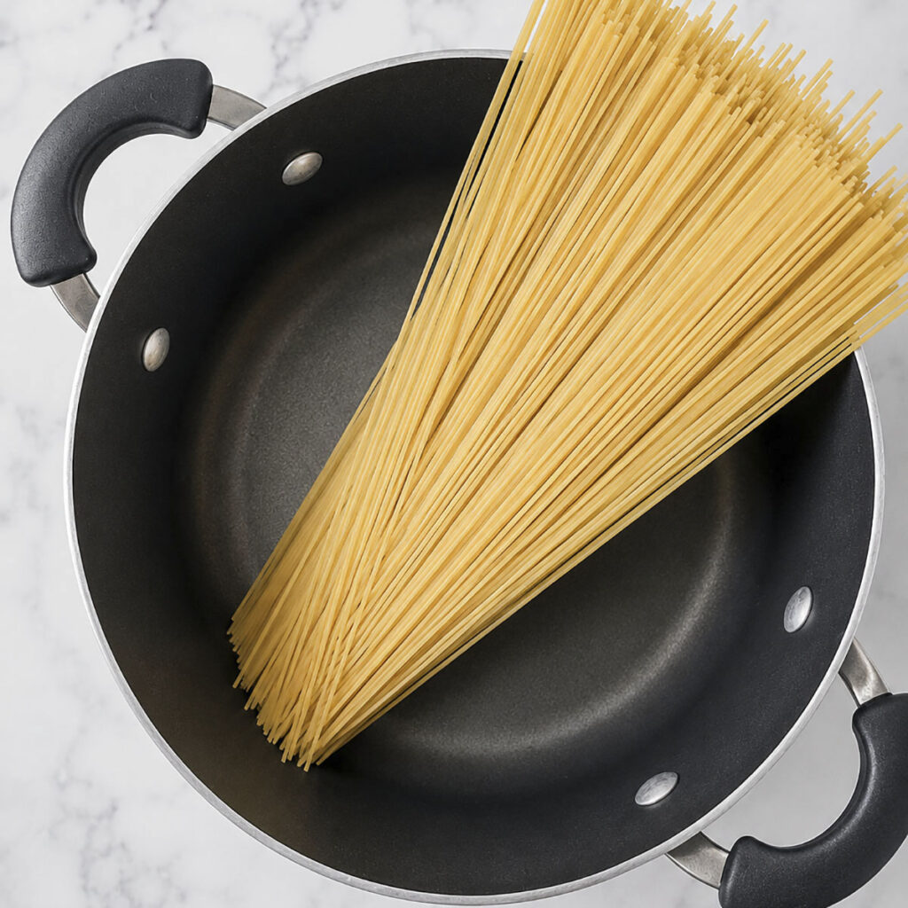  Uncooked spaghetti noodles resting inside a pot.
