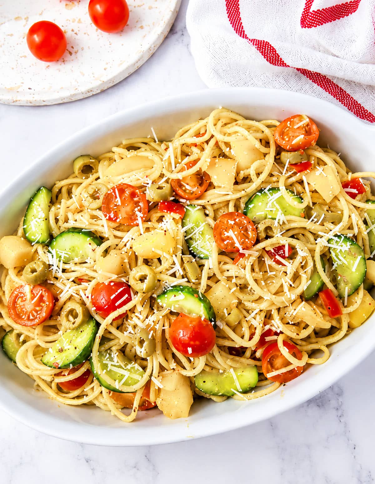 A close-up view of pasta salad with mixed vegetables.
