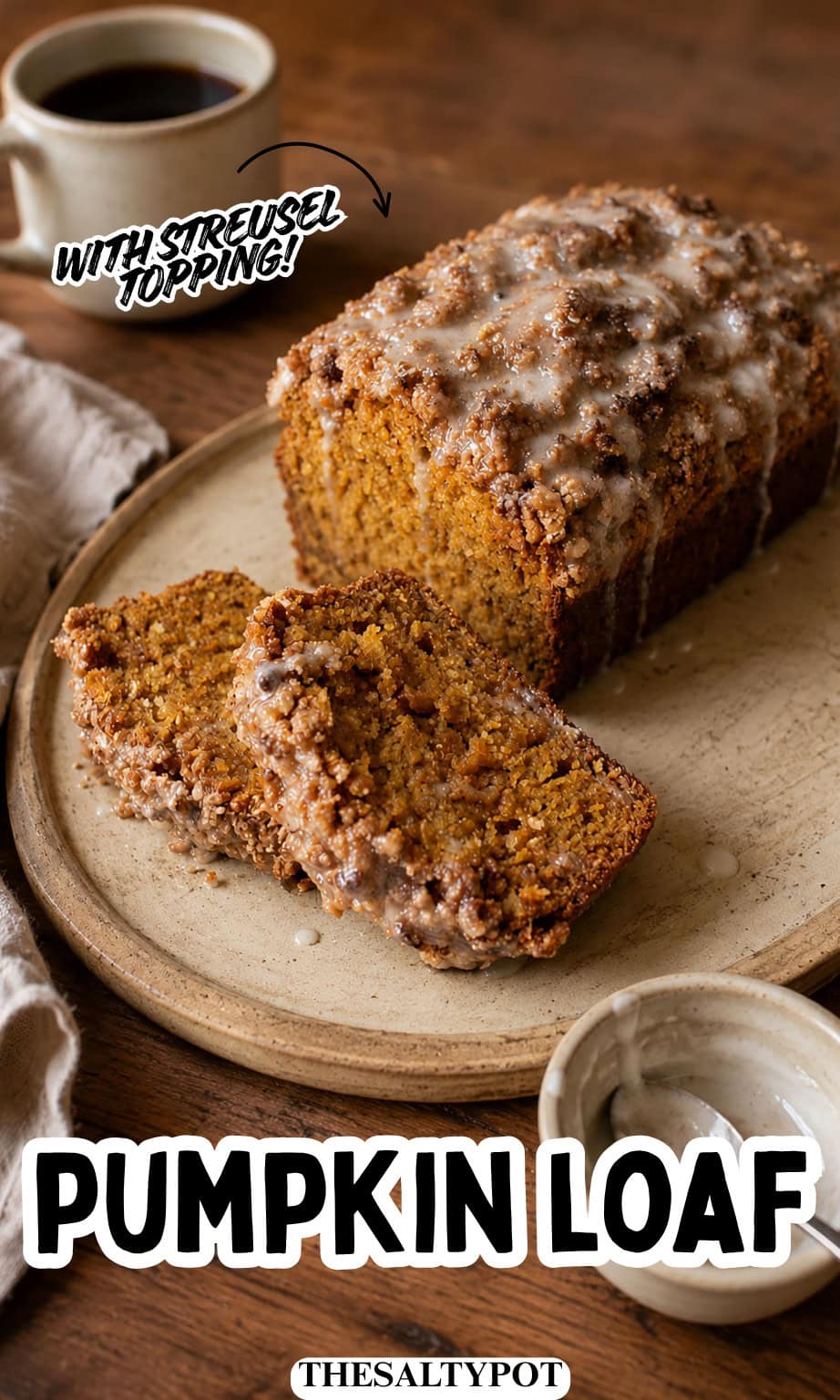Sliced loaf cake topped with sweet drizzle on a rustic plate next to a cup of coffee